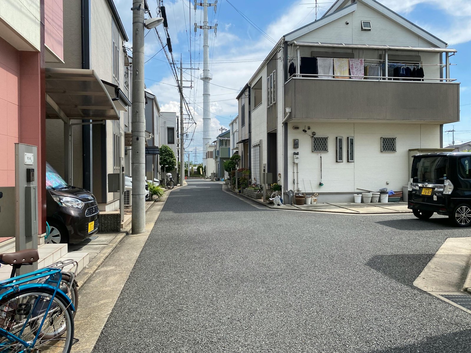 Sunny residential street with modern homes in Japan