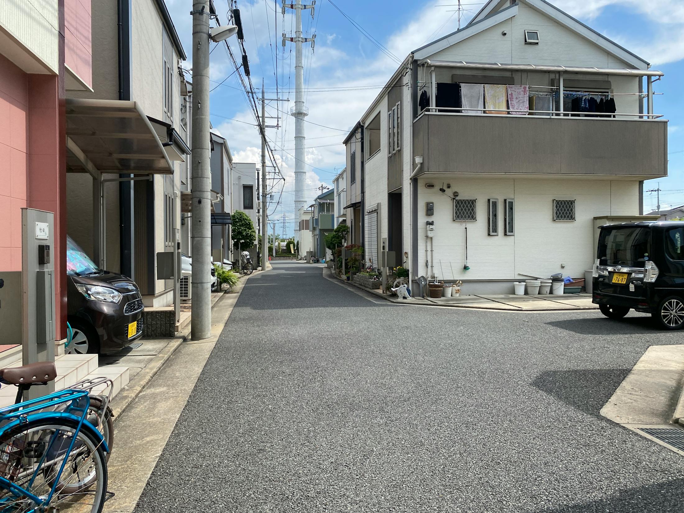 Sunny residential street with modern homes in Japan